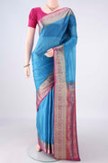Blue Banarasi Tussar Saree with Plain Body and Zari Border.  displayed on a mannequin