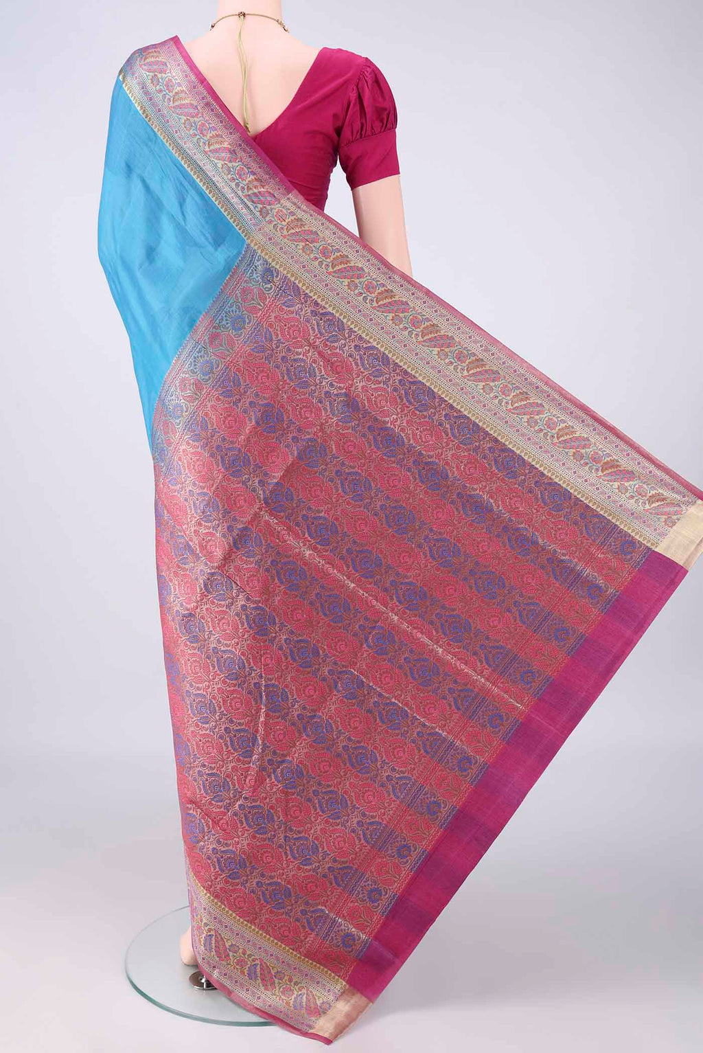 Flat view of Blue Banarasi Tussar Saree with Plain Body and Zari Border. 