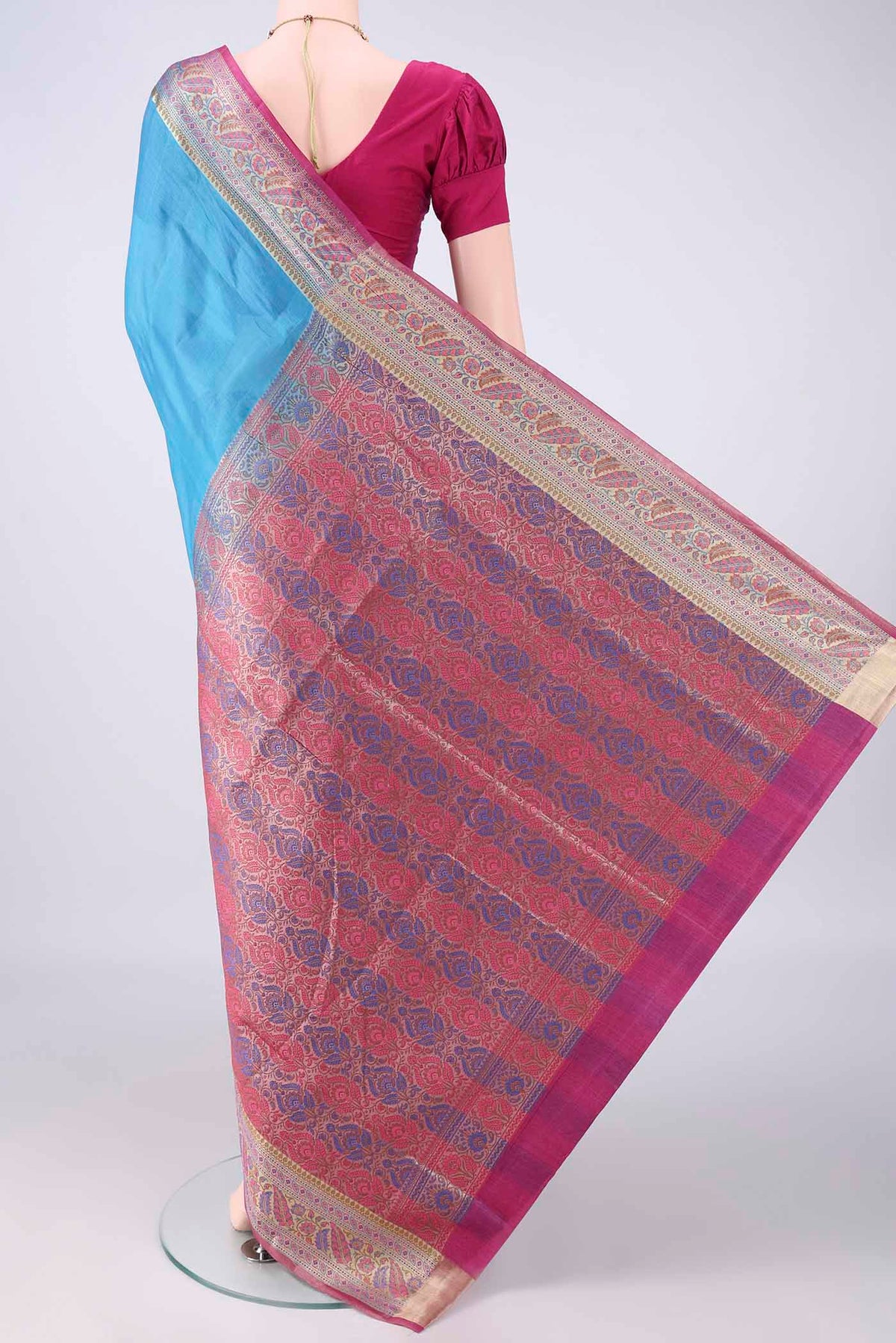 Flat view of Blue Banarasi Tussar Saree with Plain Body and Zari Border. 