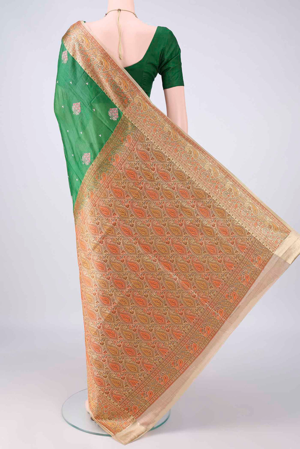 Flat view of Bottle Green Banarasi Tussar Saree with Embroidered on the body and Zari Border. 