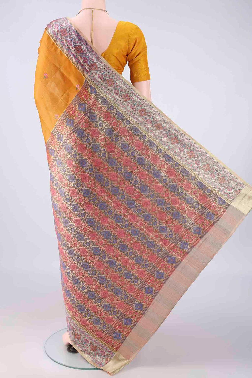 Flat view of Mustard Banarasi Tussar Saree with Embroidered on the body and Zari Border. 