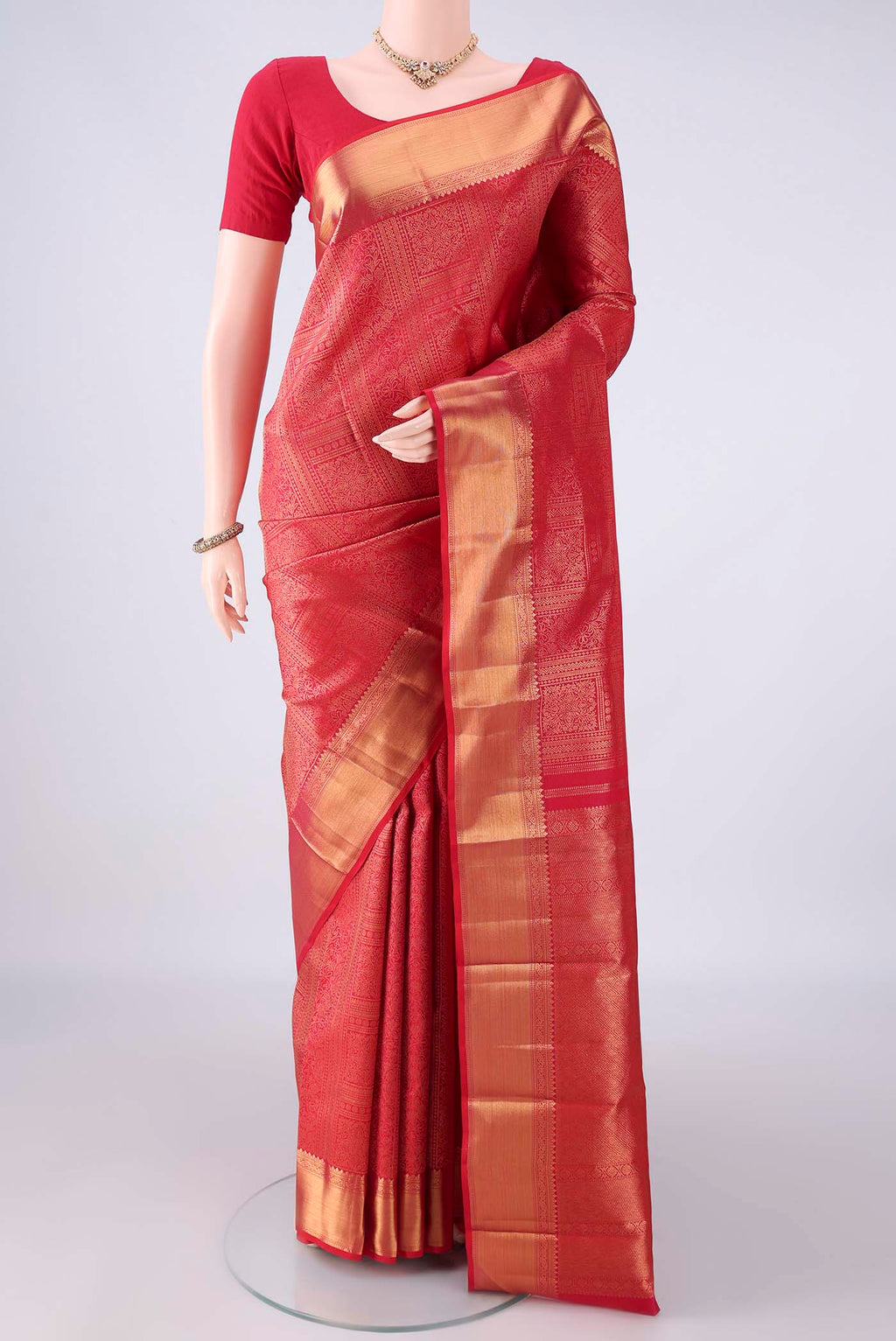 Pure Silk Dark Pink Kanchipuram Saree with Zari Brocade on the body and Zari Border.  displayed on a mannequin