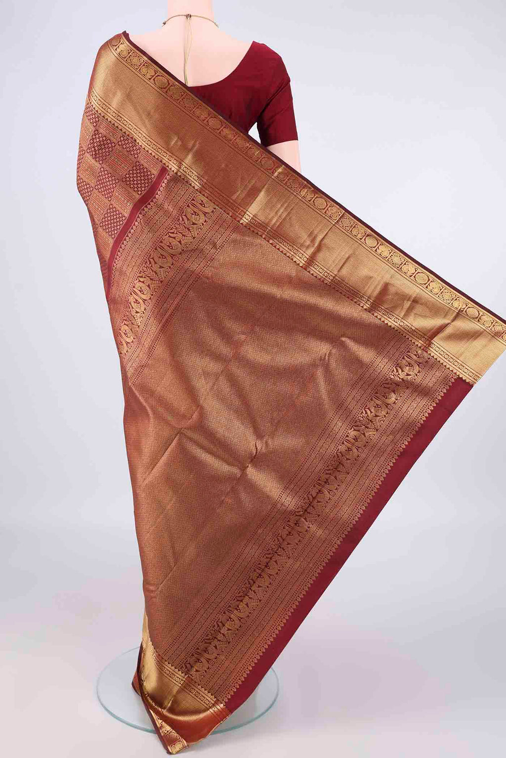 Flat view of Pure Silk Maroon Kanchipuram Saree with Zari Brocade on the body and Zari Border. 