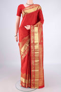 Pure Silk Red Kanchipuram Saree with Zari Butta on the body and Zari Border.  displayed on a mannequin