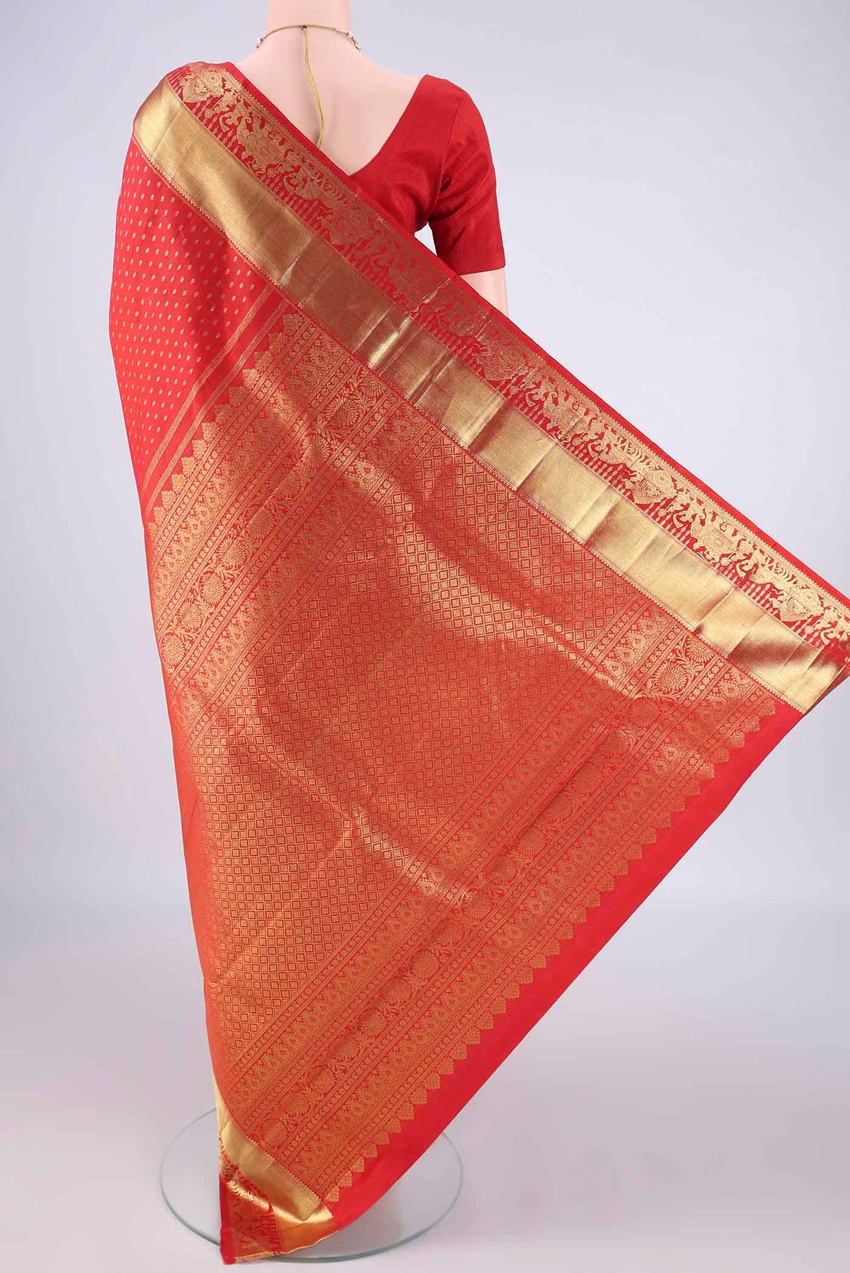 Flat view of Pure Silk Red Kanchipuram Saree with Zari Butta on the body and Zari Border. 