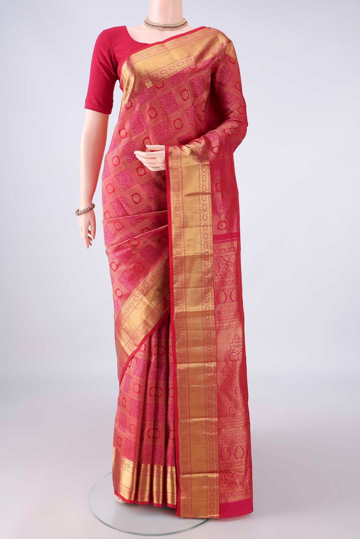 Pure Silk Dark Pink Dual Tone Kanchipuram Saree with Zari Brocade on the body and Zari Border.  displayed on a mannequin