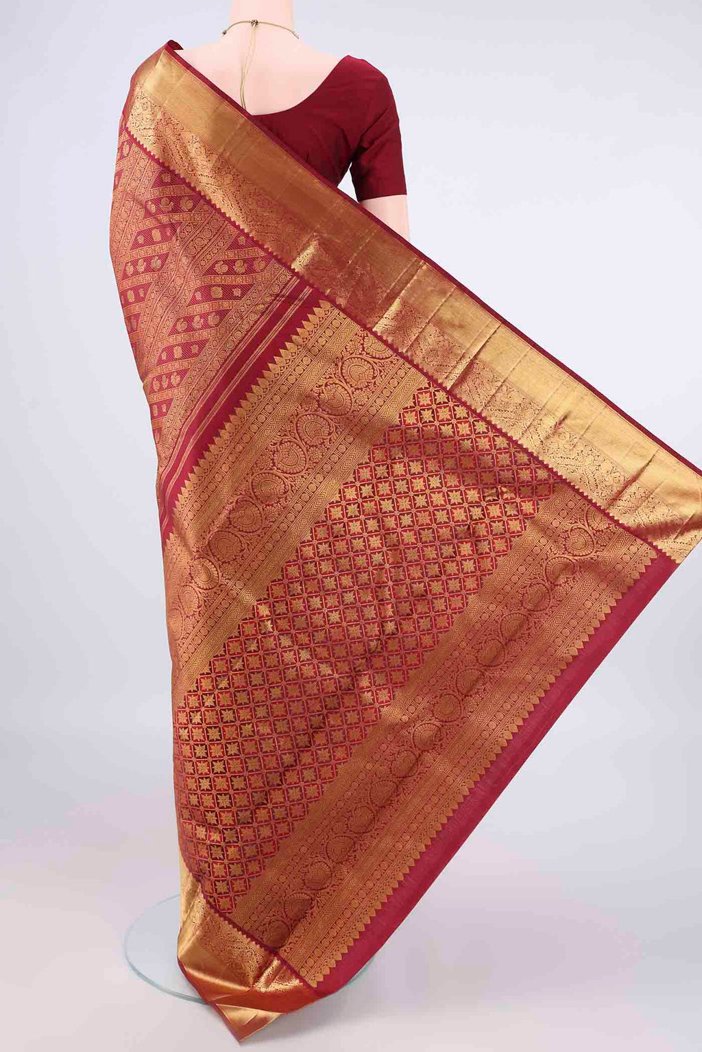 Flat view of Pure Silk Maroon Kanjivaram Saree with Zari Brocade on the body and Zari Border. 