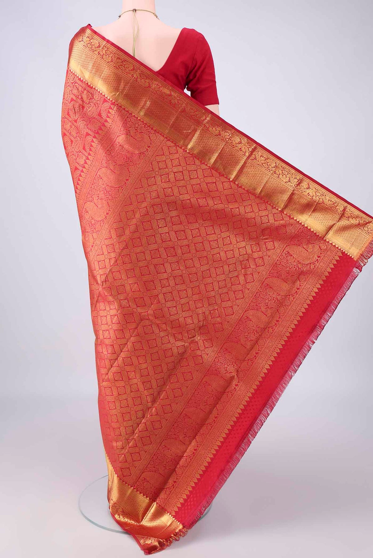 Flat view of Pure Silk Red Kanjivaram Saree with Zari Brocade on the body and Zari Border. 