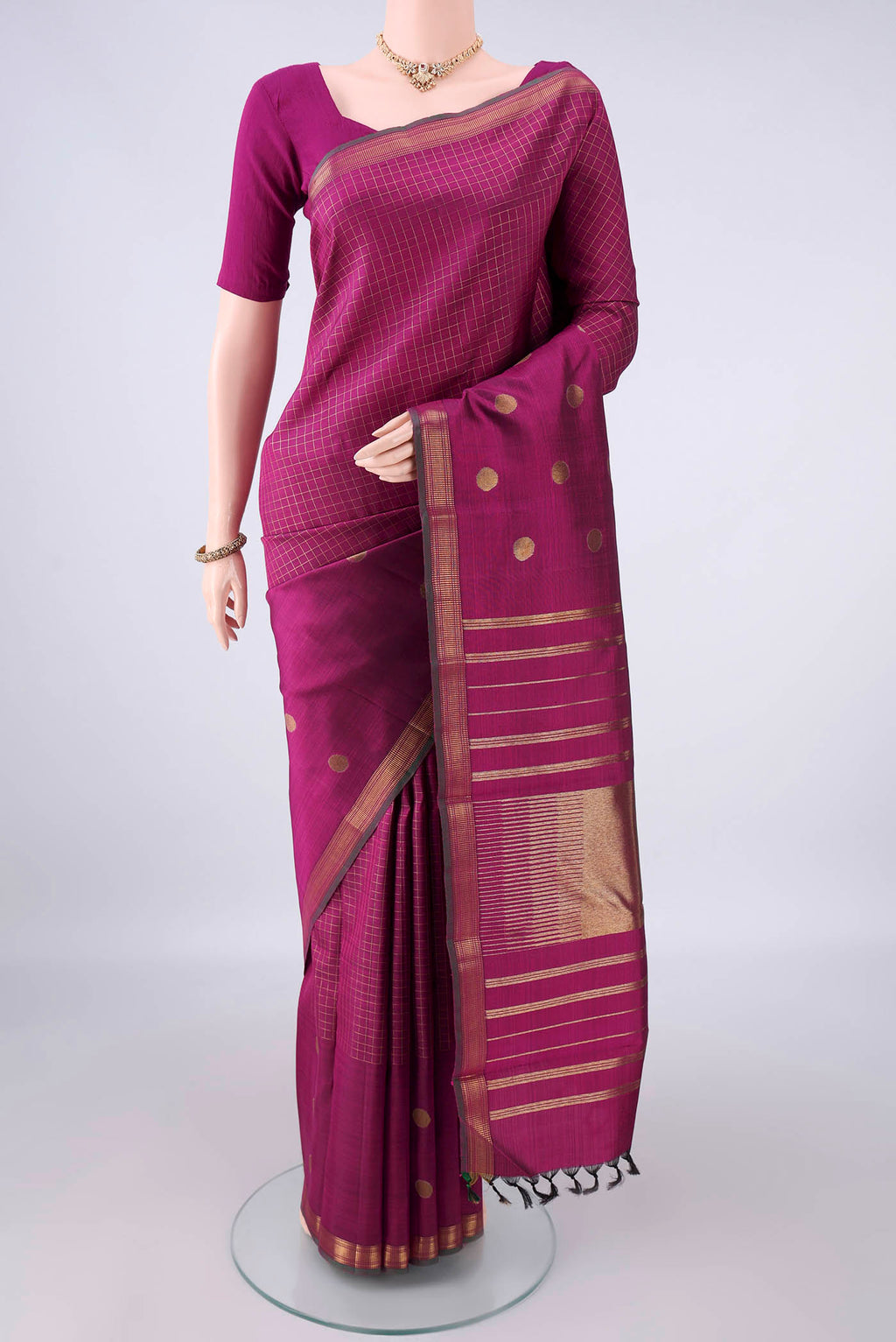 Pure Silk Pure Zari Magenta Kanchipuram Saree with Checked design on the body and Zari Border.  displayed on a mannequin