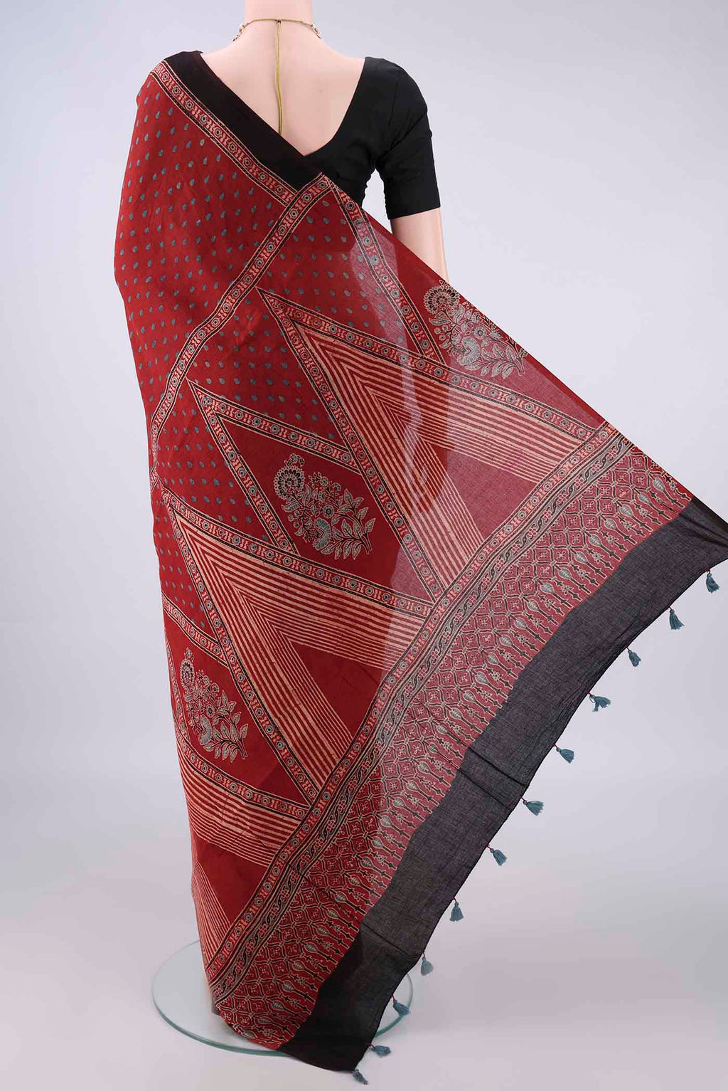 Flat view of Rust Cotton Saree with Ajrakh Print on the body and Plain Border. 