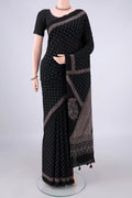 Black Cotton Saree with Ajrakh Print on the body and Plain Border.  displayed on a mannequin