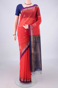 Coral Silk Cotton Saree with Zari Butta on the body and Zari Border.  displayed on a mannequin
