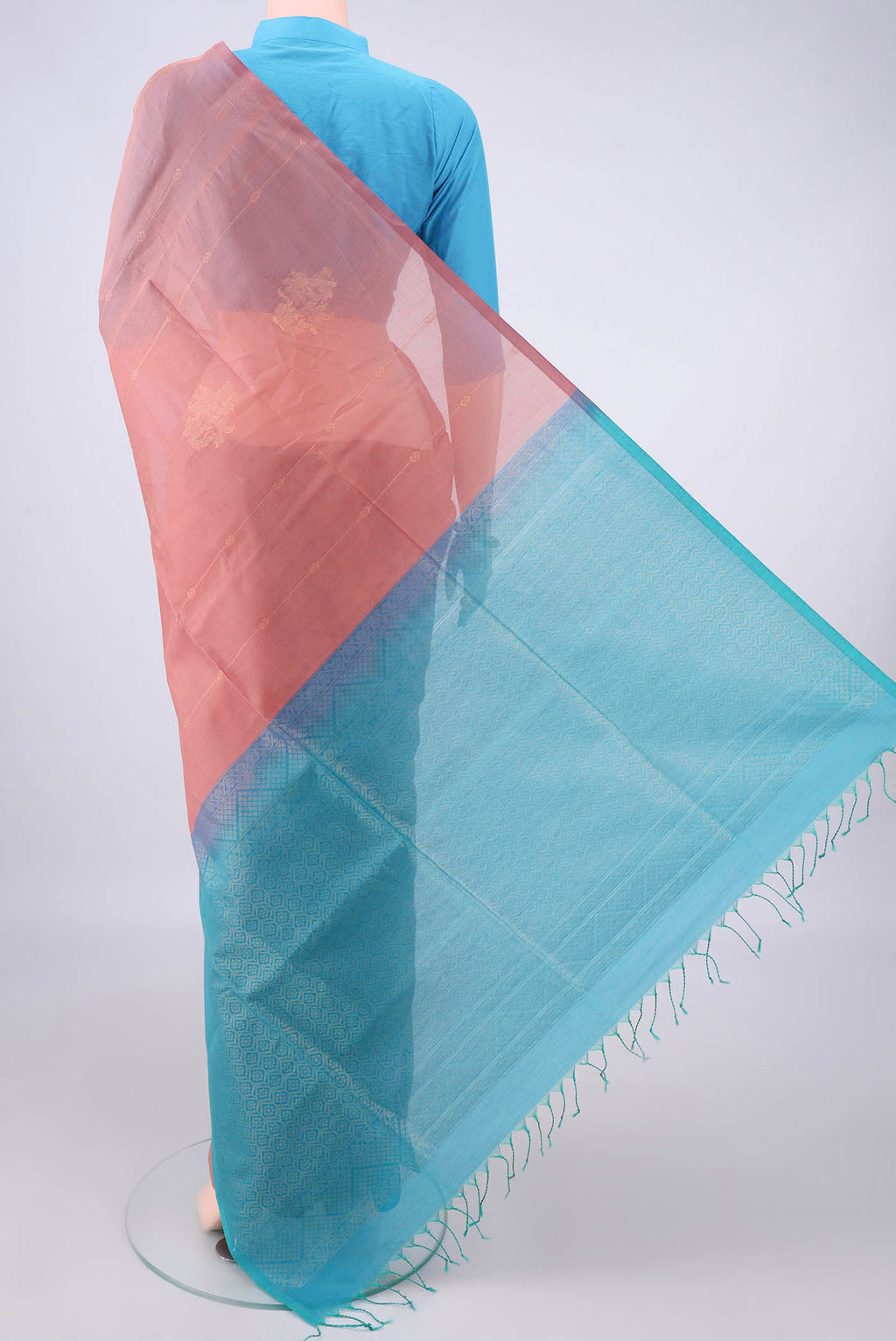 Flat view of Peach Silk Cotton Saree with Zari Butta on the body and Without Border. 