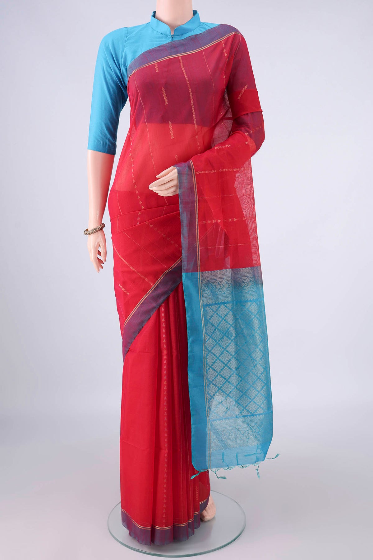 Red Silk Cotton Saree with Stripes on the body and Plain Border.  displayed on a mannequin