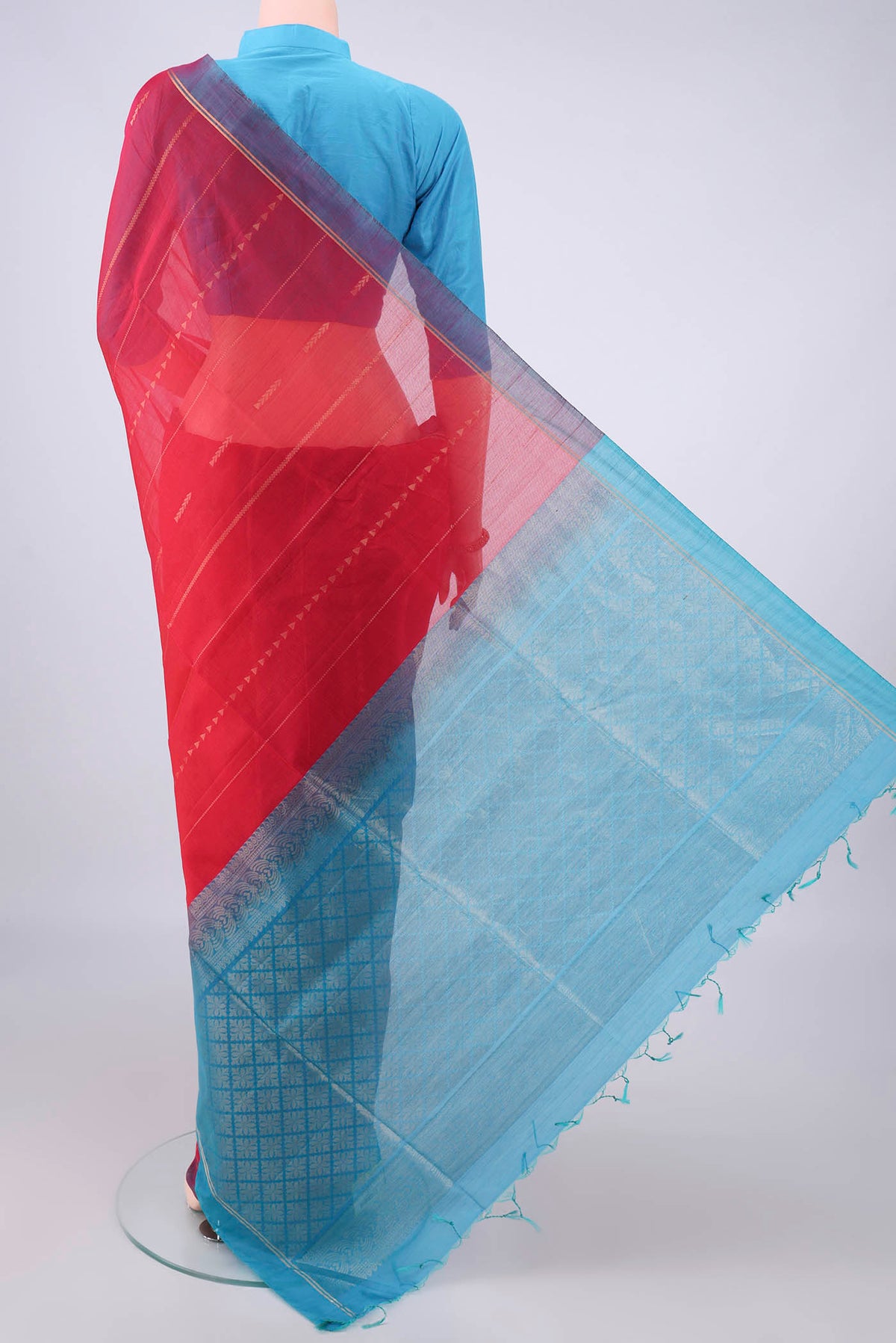 Flat view of Red Silk Cotton Saree with Stripes on the body and Plain Border. 