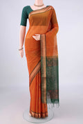 Brick Orange Silk Cotton Saree with Zari And Thread Butta on the body and Zari Border.  displayed on a mannequin