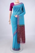 Blue Silk Cotton Saree with Zari Butta on the body and Zari Border.  displayed on a mannequin
