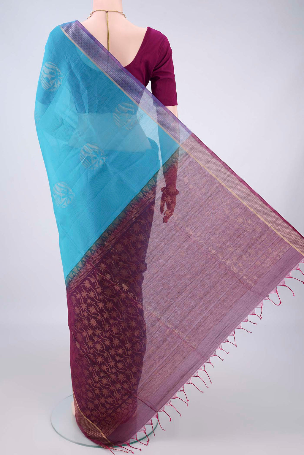Flat view of Blue Silk Cotton Saree with Zari Butta on the body and Zari Border. 