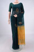 Bottle Green Silk Cotton Saree with Zari And Thread Butta on the body and Without Border.  displayed on a mannequin