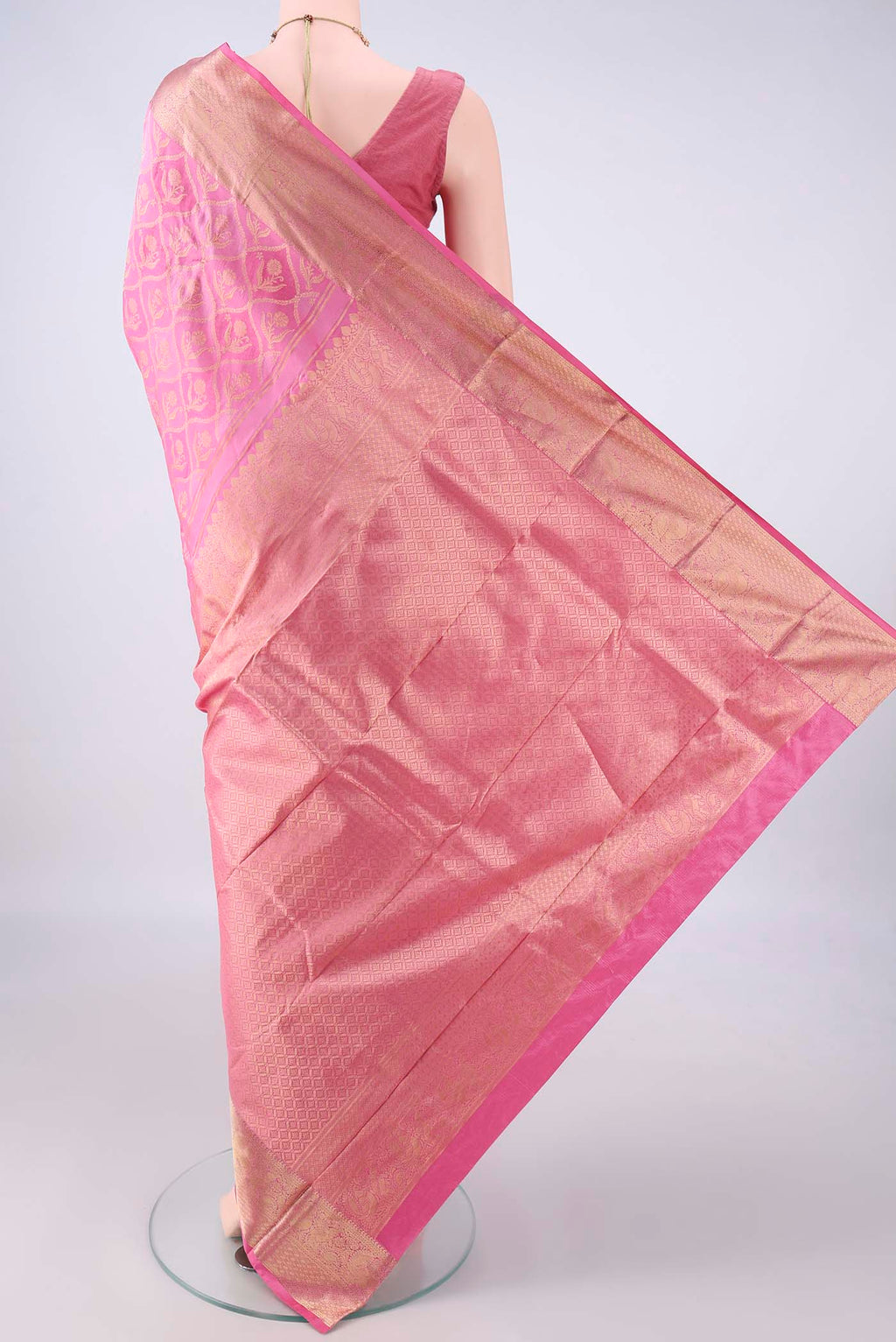 Flat view of Pure Silk Rose pink Kanjivaram Saree with Zari Brocade on the body and Zari Border. 