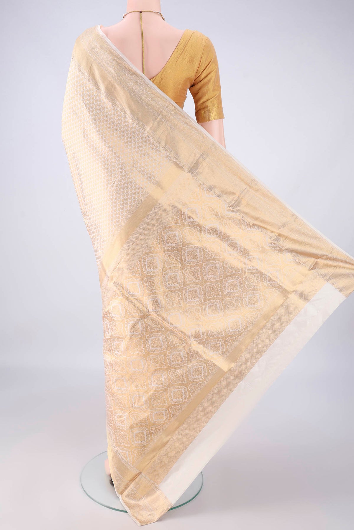Flat view of Pure Silk Off White Kanjivaram Saree with Zari Brocade on the body and Zari Border. 
