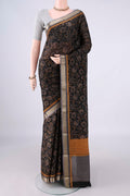 Black Mysore Crepe Saree with Printed design on the body and Zari Border.  displayed on a mannequin