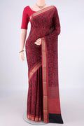 Black Mysore Crepe Saree with Printed design on the body and Zari Border.  displayed on a mannequin