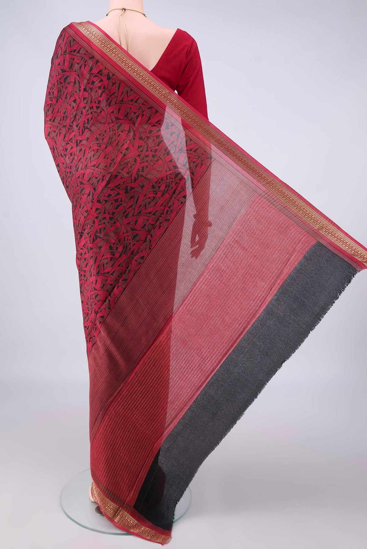 Flat view of Black Mysore Crepe Saree with Printed design on the body and Zari Border. 