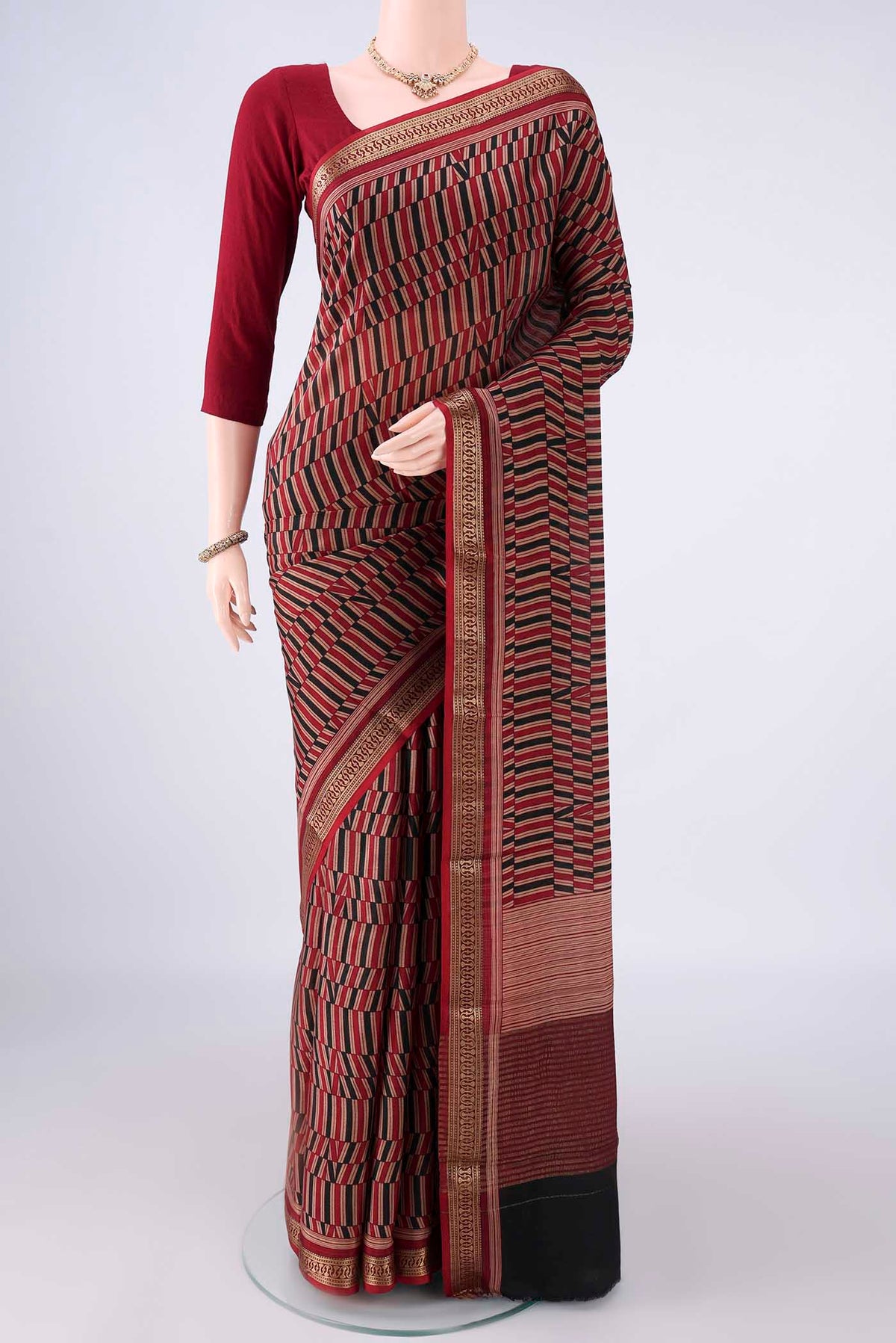 Multi Color Mysore Crepe Saree with Printed design on the body and Zari Border.  displayed on a mannequin