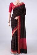 Black Mysore Crepe Saree with Printed design on the body and Zari Border.  displayed on a mannequin