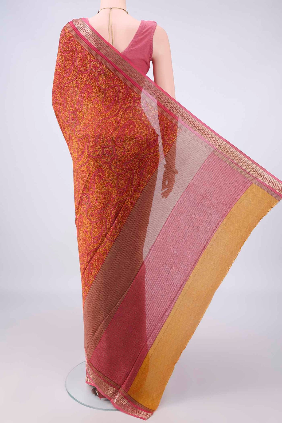 Flat view of Mustard Mysore Crepe Saree with Printed design on the body and Zari Border. 