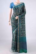 Sea Green Mysore Crepe Saree with Printed design on the body and Zari Border.  displayed on a mannequin
