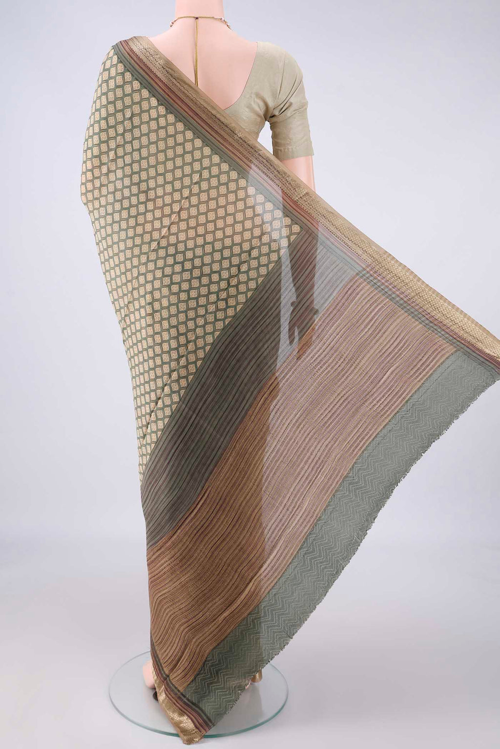 Flat view of Beige Mysore Crepe Saree with Printed design on the body and Zari Border. 