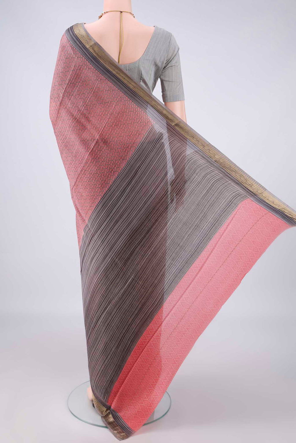 Flat view of Peach Mysore Crepe Saree with Printed design on the body and Zari Border. 