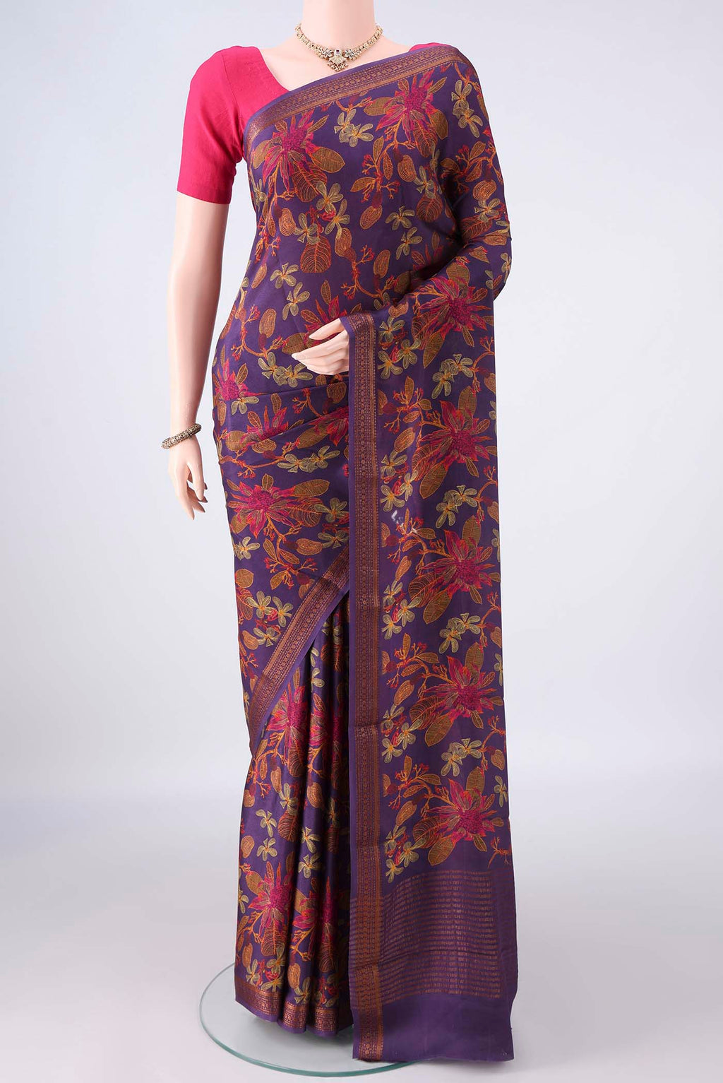 Purple Mysore Crepe Saree with Printed design on the body and Zari Border.  displayed on a mannequin