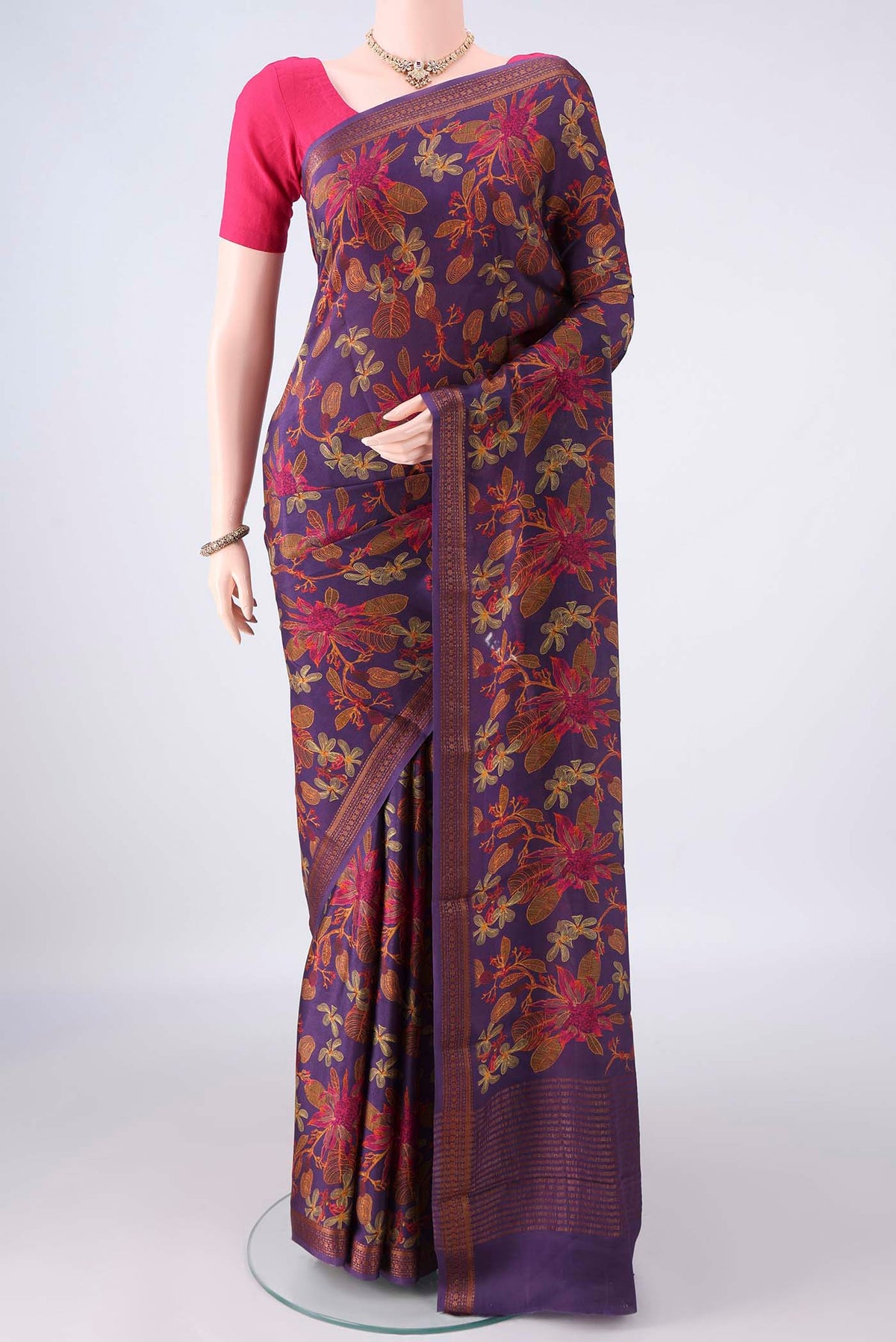 Purple Mysore Crepe Saree with Printed design on the body and Zari Border.  displayed on a mannequin