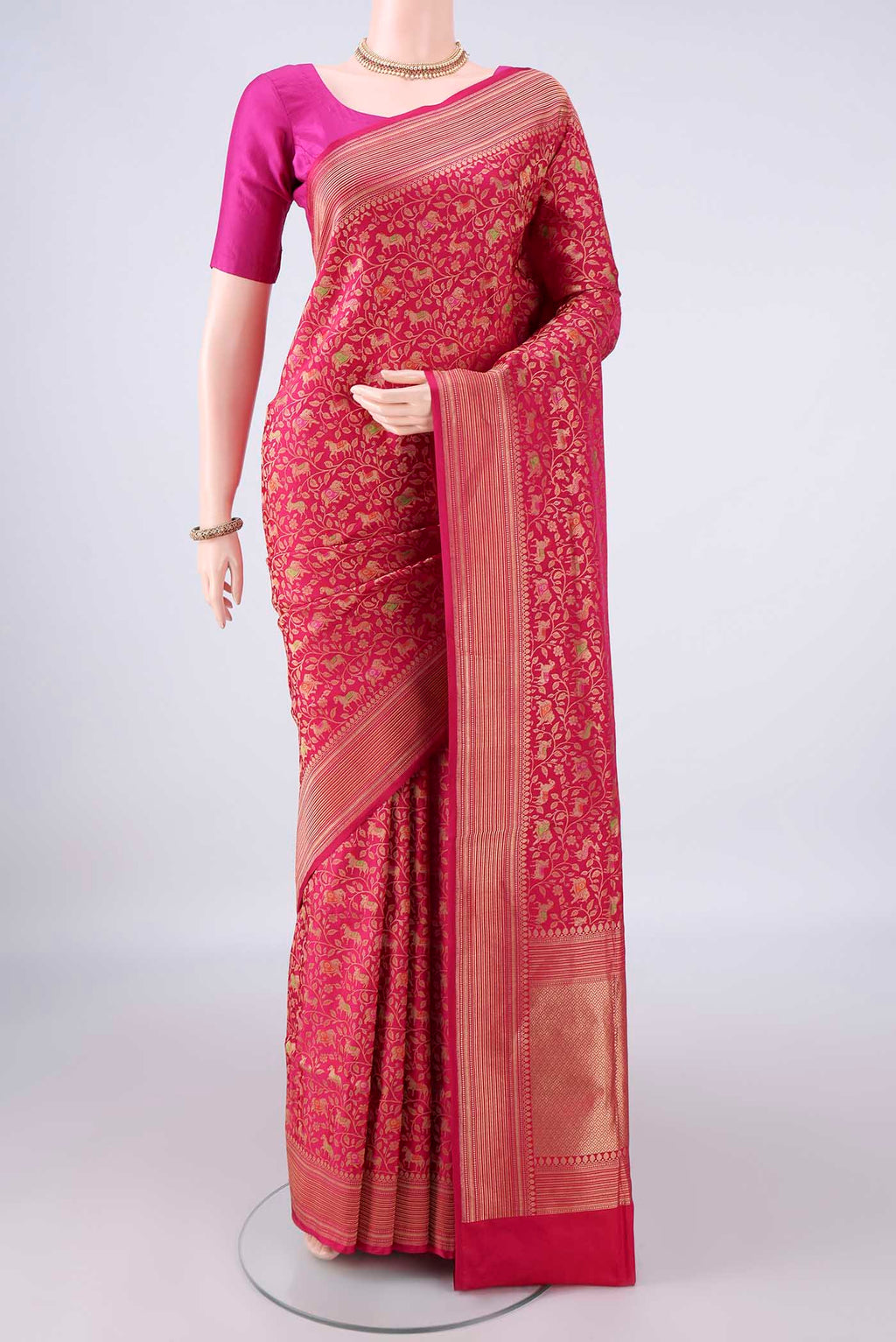 Pure Silk Coral Banarasi Saree with Zari Brocade on the body and Zari Border.  displayed on a mannequin