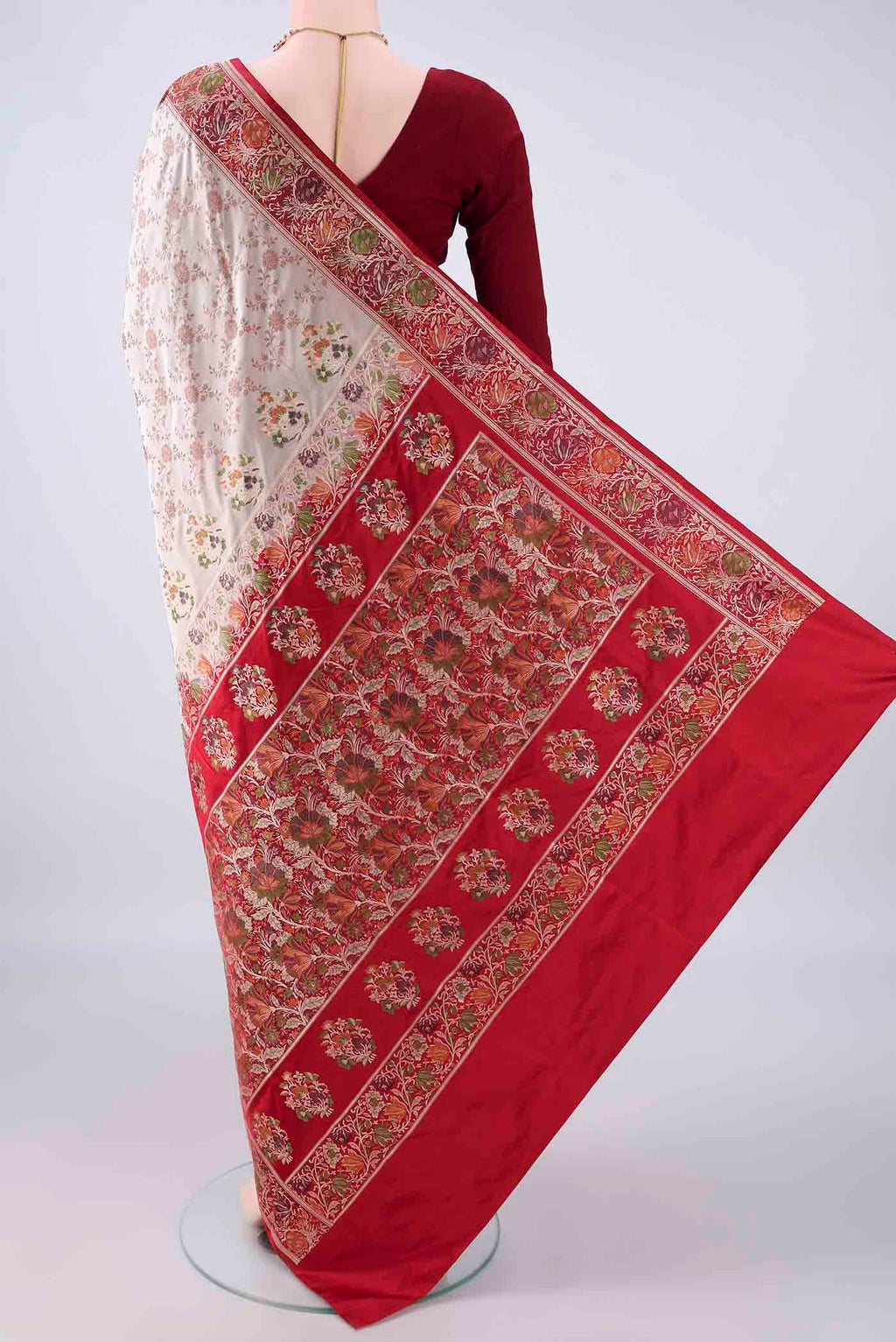 Flat view of Beige Banarasi Jamavar Saree with Thread Brocade on the body and Zari Border. 