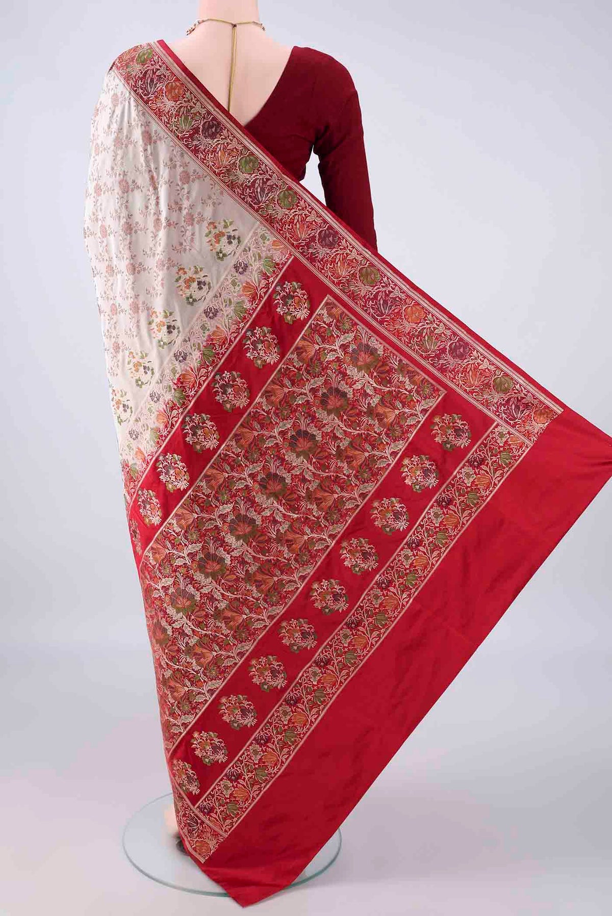 Flat view of Beige Banarasi Jamavar Saree with Thread Brocade on the body and Zari Border. 