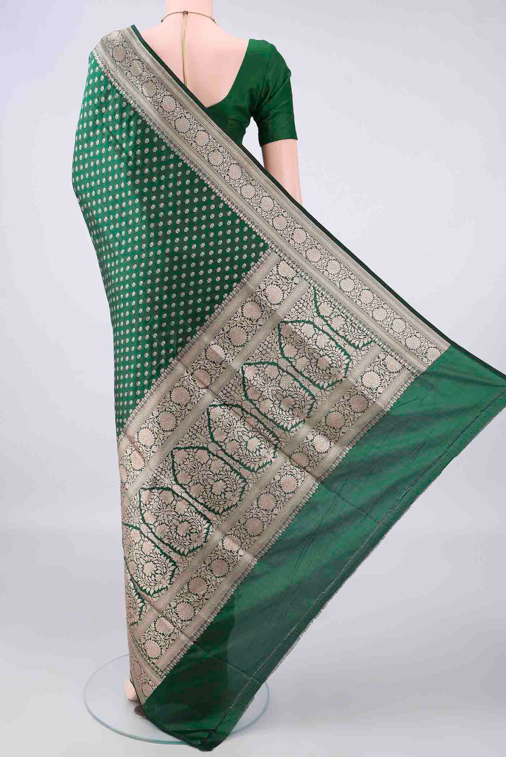 Flat view of Pure Silk Bottle Green Banarasi Saree with Zari Butta on the body and Zari Border. 