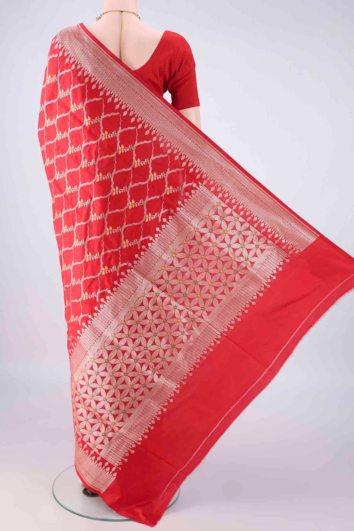 Flat view of Pure Silk Red Banarasi Saree with Zari And Thread Butta on the body and Zari Border. 