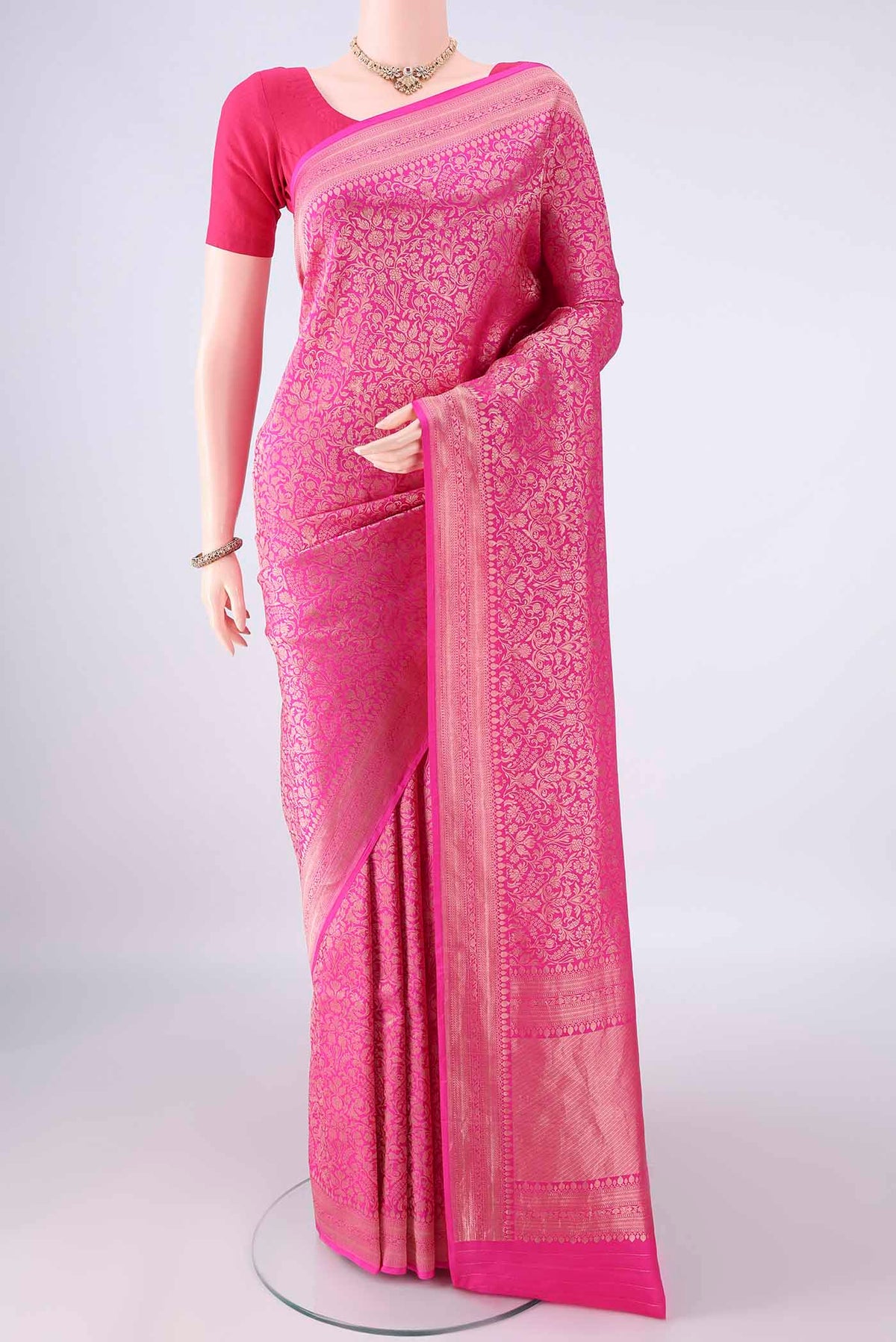 Pure Silk Pink Banarasi Saree with Zari Brocade on the body and Zari Border.  displayed on a mannequin