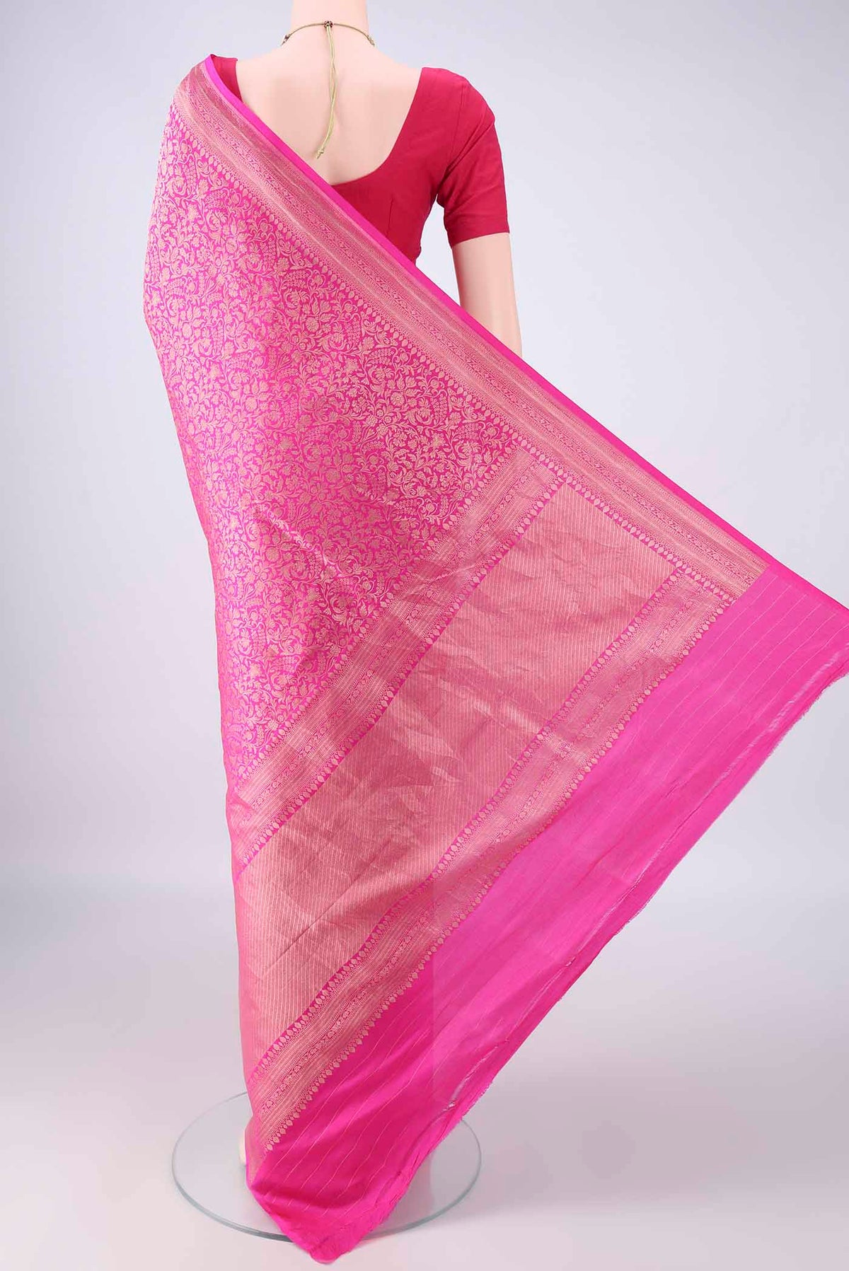 Flat view of Pure Silk Pink Banarasi Saree with Zari Brocade on the body and Zari Border. 