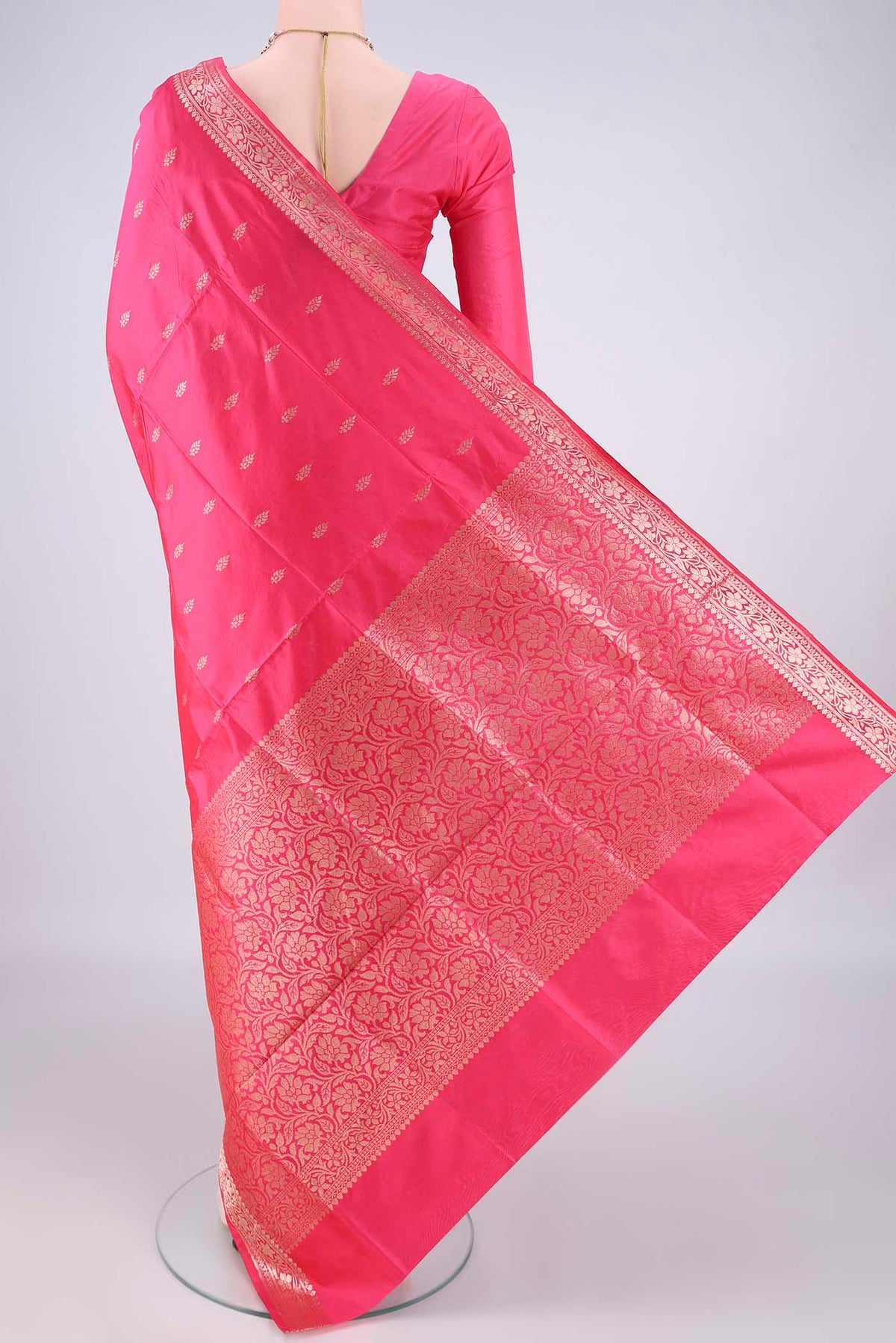 Flat view of Pure Silk Coral Banarasi Katan Saree with Zari Butta on the body and Zari Border. 