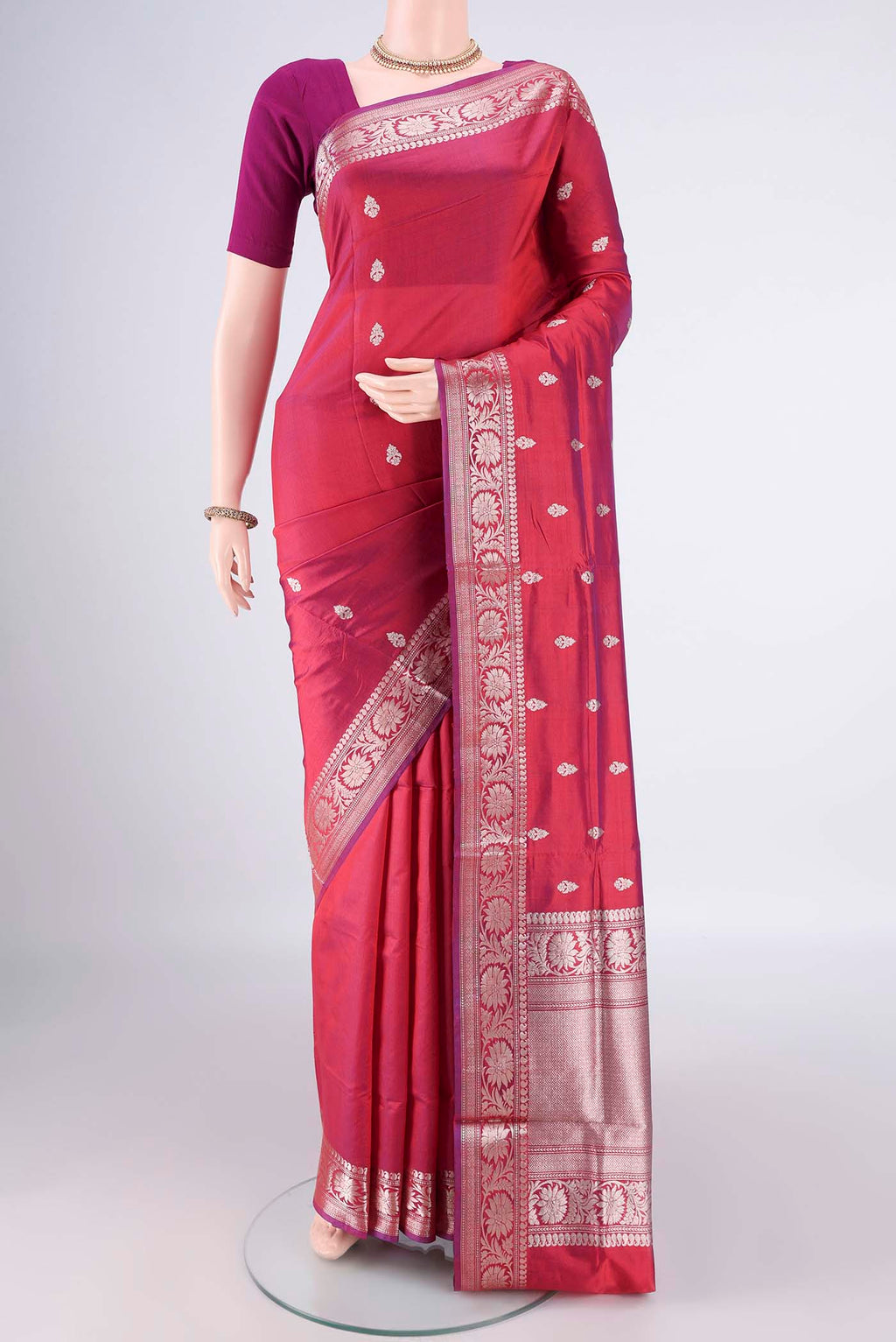 Pure Silk Magenta Dual Tone Banarasi Katan Saree with Zari Butta on the body and Zari Border.  displayed on a mannequin