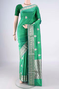 Pure Silk Green Dual Tone Banarasi Katan Saree with Zari Butta on the body and Zari Border.  displayed on a mannequin