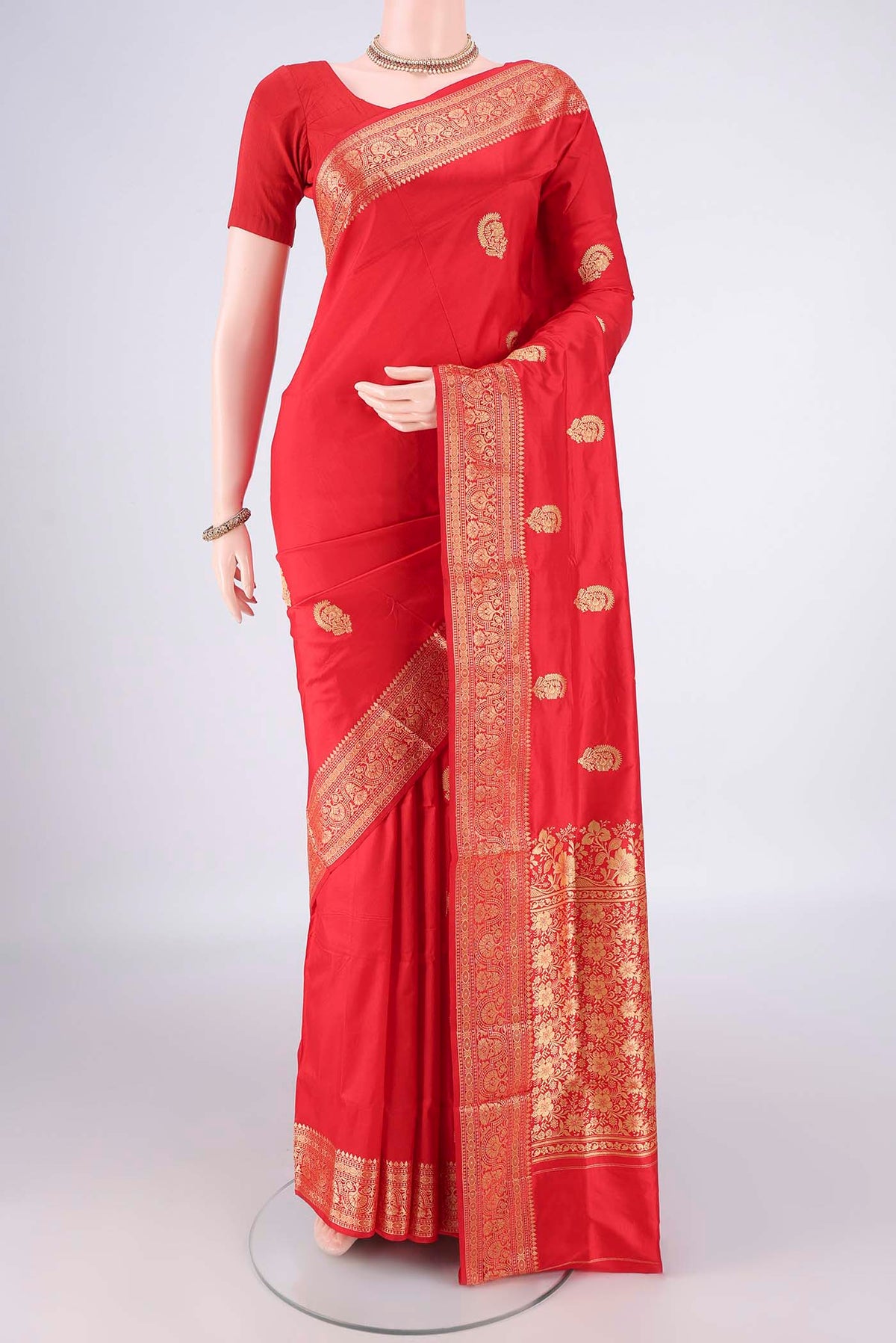 Pure Silk Red Banarasi Katan Saree with Zari Butta on the body and Zari Border.  displayed on a mannequin