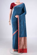 Pure Silk Blue Banarasi Katan Saree with Zari Butta on the body and Zari Border.  displayed on a mannequin