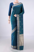 Pure Silk Peacock Blue Banarasi Katan Saree with Thread Butta on the body and Thread Border.  displayed on a mannequin