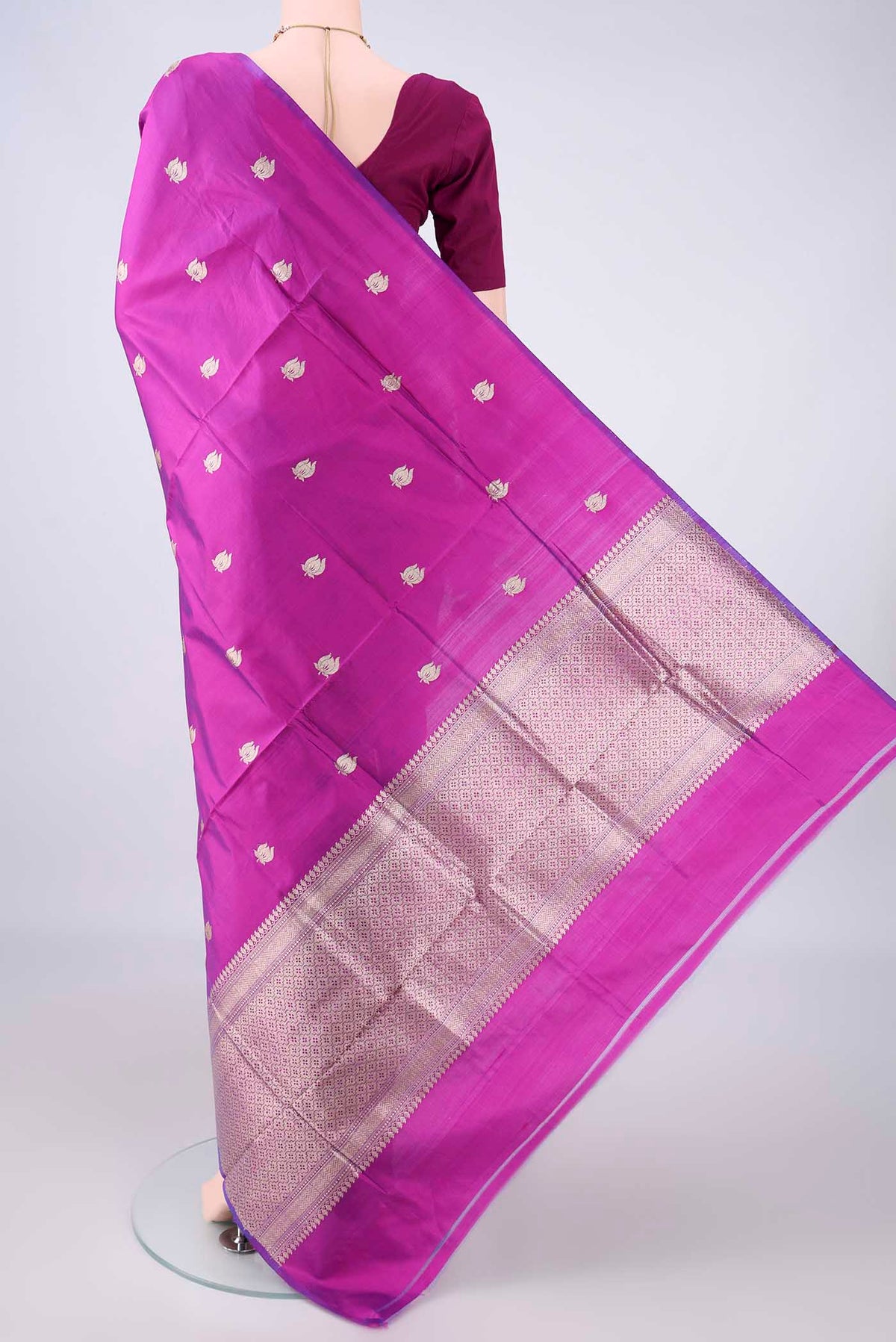 Flat view of Pure Silk Magenta Banarasi Katan Saree with Zari Butta on the body and Without Border. 